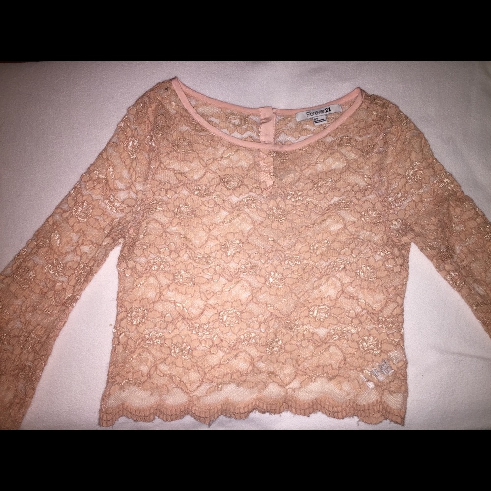Blush lace top with bell sleeves.